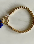 5mm 14k gold filled beaded bracelet with charm holder and hand carved lapis lazuli cloud charm.