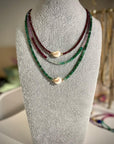 Garnet and baroque pearl, multi gemstone strand and raw emerald and baroque pearl necklace.
