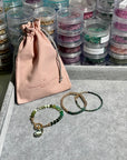 Shades of green smooth gem stones with oversized clasp and hand carved green amethyst cloud charm, 4mm 14k gold filled bracelet with band of raw emeralds and raw emerald bracelet with clasp.