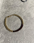 5mm 14k gold filled bracelet with band of faceted garnet and clasp.