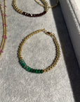 4mm 14k gold filled bracelet with band of smooth emerald beads and clasp.
