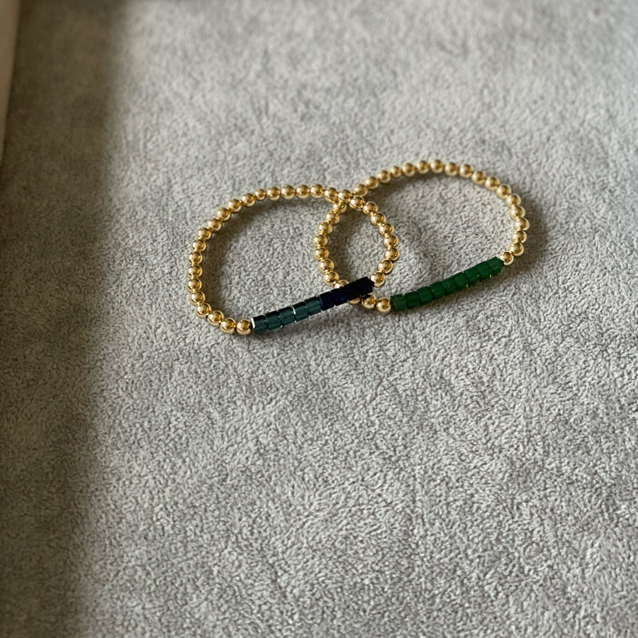 5mm 14k gold filled with blues and green Swarovski crystal cubes.