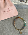 Soft multi coloured smooth gemstone bracelet with clasp.