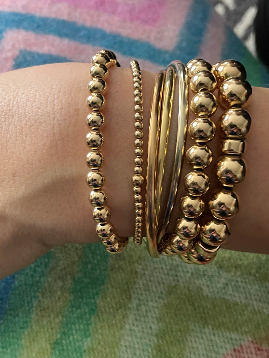 Left to right - 6m 14k gold filled bracelet, 3mm 14k gold filled bracelet, clients own, 8mm 14k gold filled bracelet and 10mm gold filled bracelet with rondelle spacers.