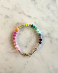 Vibrant multi coloured smooth gemstone bracelet with clasp.