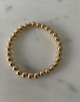 6mm 14k gold filled bracelet with 8mm band of beads.