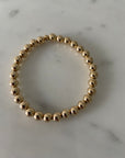 6mm 14k gold filled bracelet with 8mm band of beads.