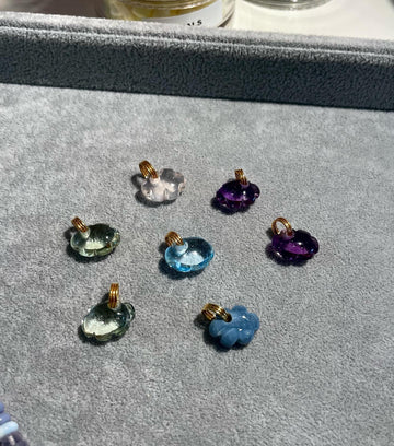 One of a kind hand carved natural stone cloud charms with 14k bail. Available in green amethyst, purple amethyst, pink topaz, blue topaz, blue agate and lapis lazuli (not shown). More stones available to order.